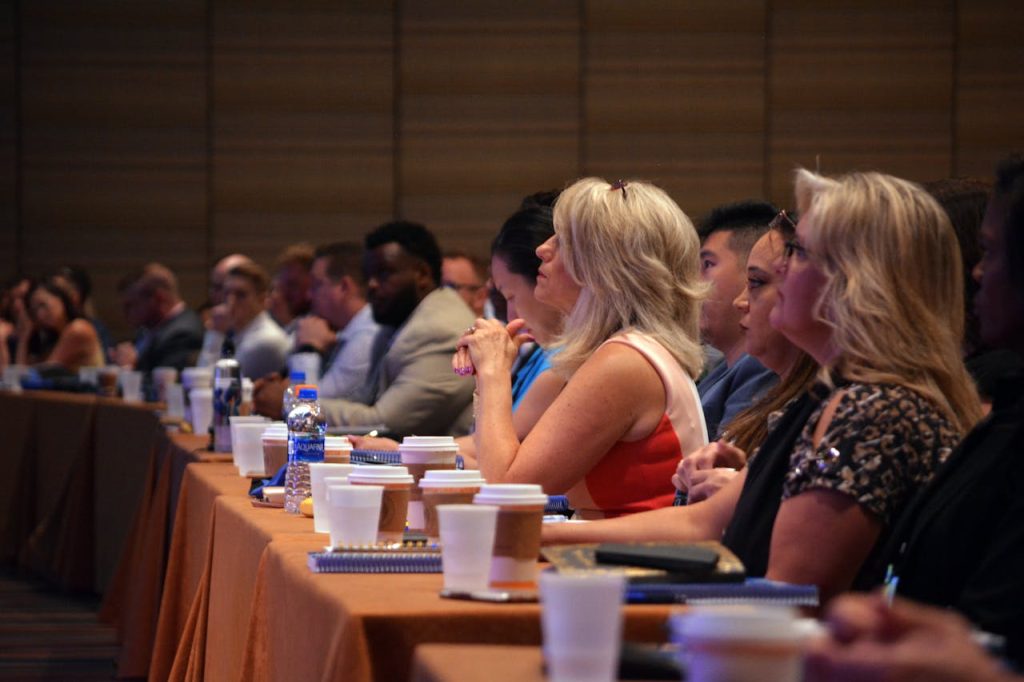 a-group-of-administration-inside-of-conference-room-3678057 Diverse group of business professionals attentive during a conference session in a meeting room.